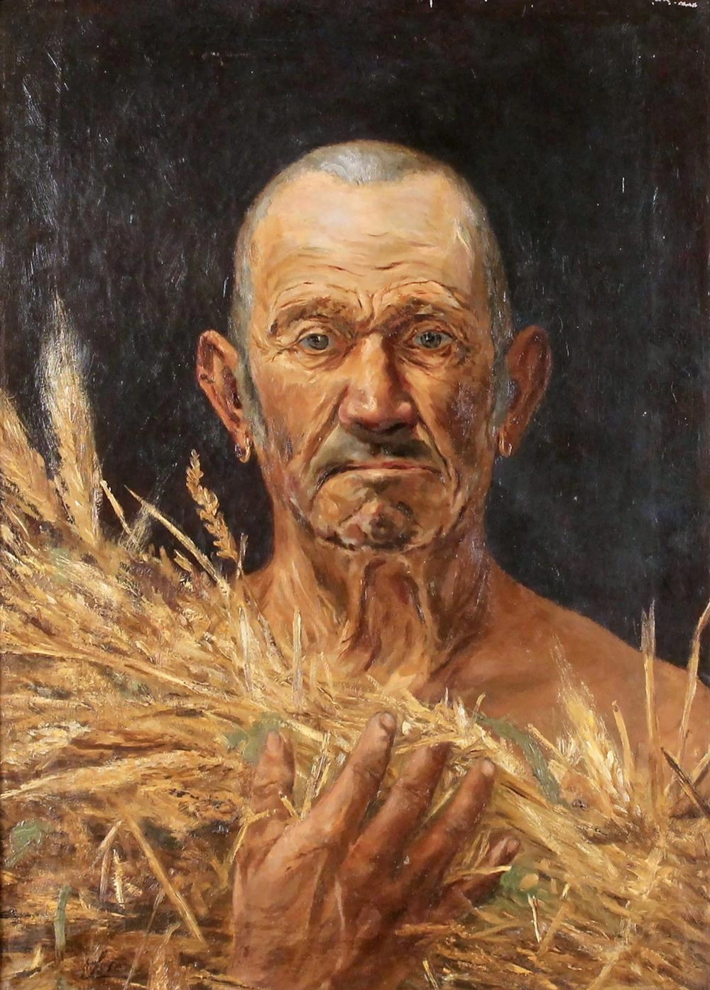 Contadino con spighe di grano